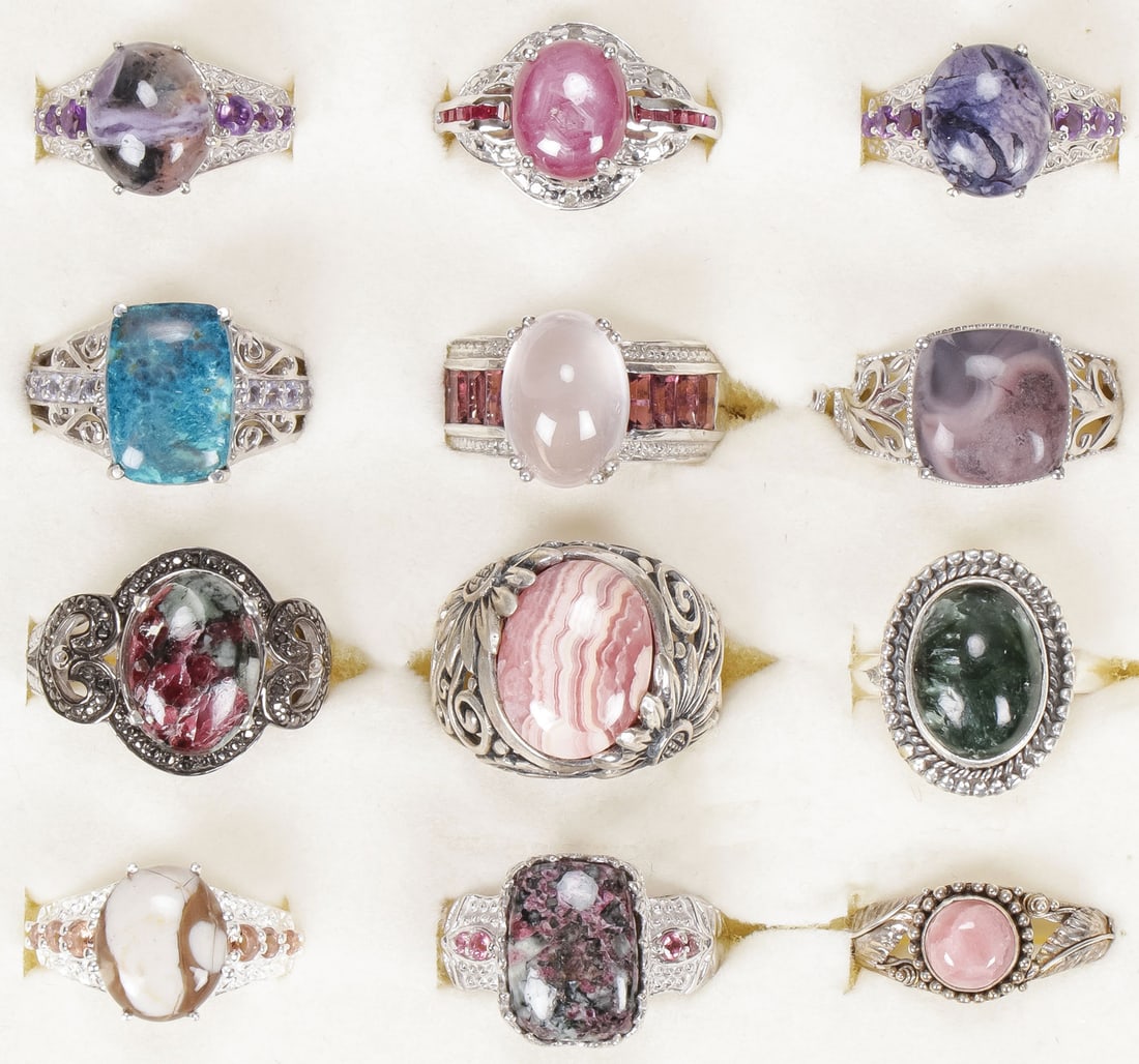 12 STERLING WOMAN'S FASHION RINGS: 12 STERLING WOMAN'S FASHION RINGS. Comprising 12 sterling silver rings set with a variety of precious and semi-precious gemstones, including Russian Eudialyte, peanut wood jasper, Galilea Rose Quartz,