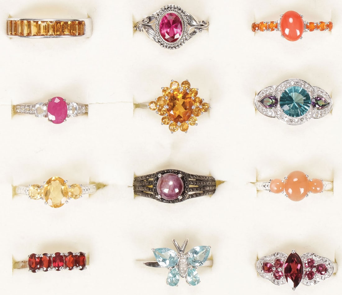 12 STERLING WOMAN'S FASHION RINGS: 12 STERLING WOMAN'S FASHION RINGS. Comprising 12 sterling silver rings set with a variety of precious and semi-precious gemstones, including Burmese Ruby, Kenyan Ruby, apatite, yellow citrine, coral, 