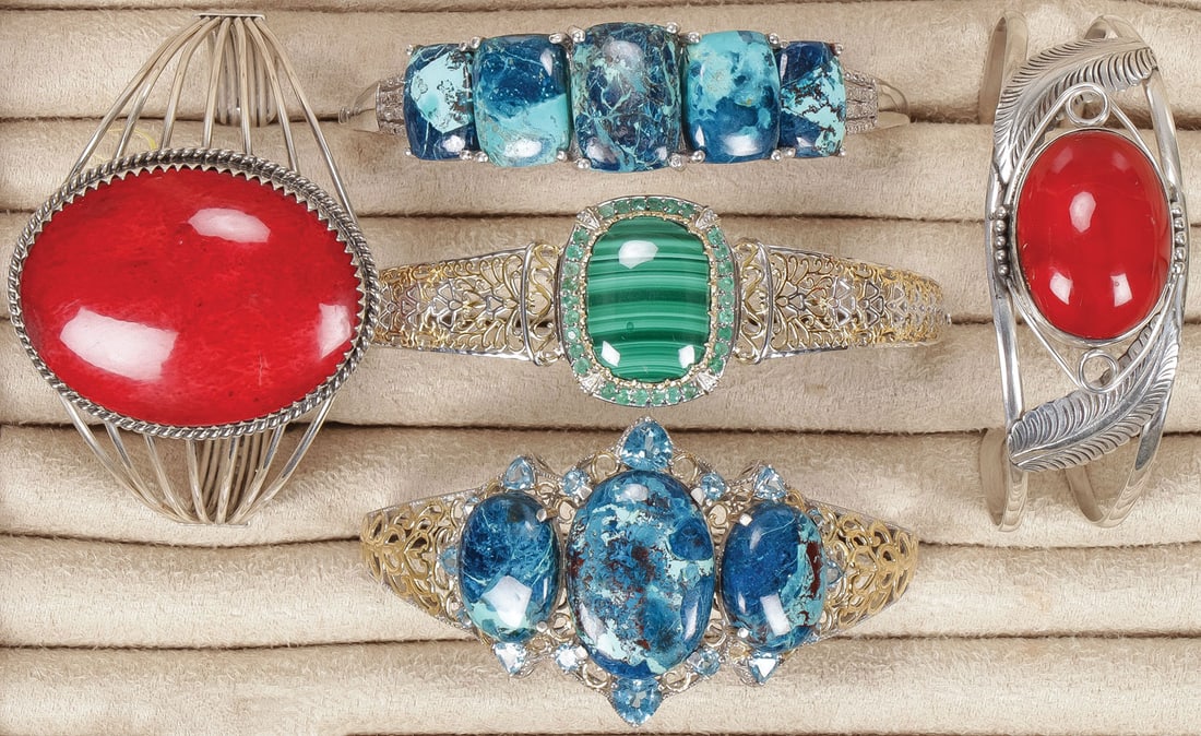 FIVE SILVER SOUTHWEST STYLE BRACELETS: FIVE SILVER SOUTHWEST STYLE BRACELETS. Comprising five silver bracelets set with a variety of semi-precious gemstones including Table Mountain Shadowkite, African Malachite, and Coral. SHIPPING NOTICE