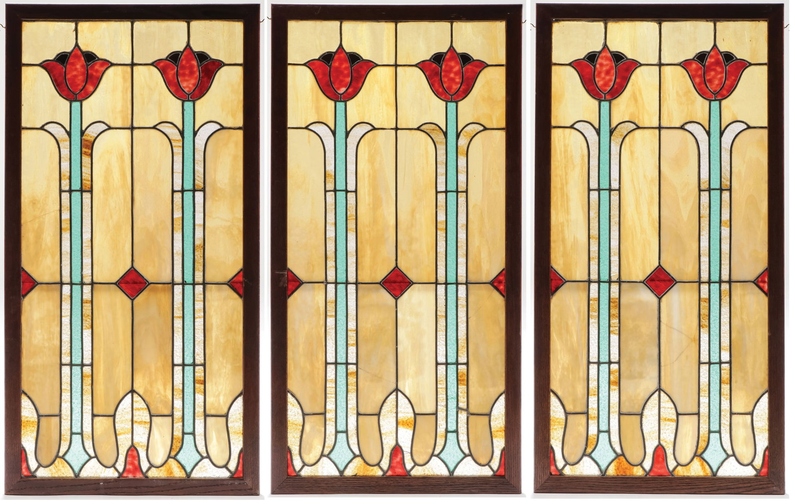 SET OF 3 ARTS-N-CRAFTS LEADED WINDOWS: SET OF 3 ARTS-N-CRAFTS LEADED WINDOWS. Comprising a set of three matching leaded and slag glass framed window panels depicting tulips. Each measuring 40 inches x 20.25 inches. SHIPPING NOTICE: Except