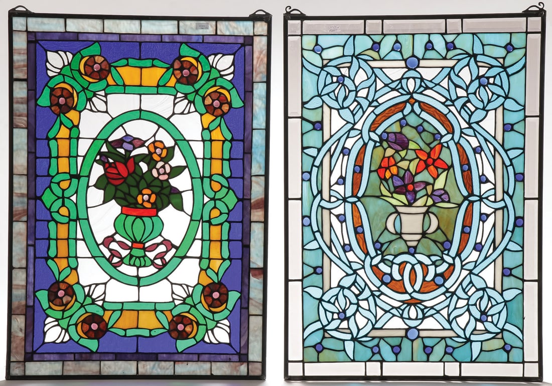 A PAIR OF LEADED GLASS PANELS, C. 1900: A PAIR OF LEADED GLASS PANELS, C. 1900. Each contained in metal frame with suspension loops on top with floral decoration with jewels and clear beveled glass panels. Each measuring 28 x 20 inches. Pro