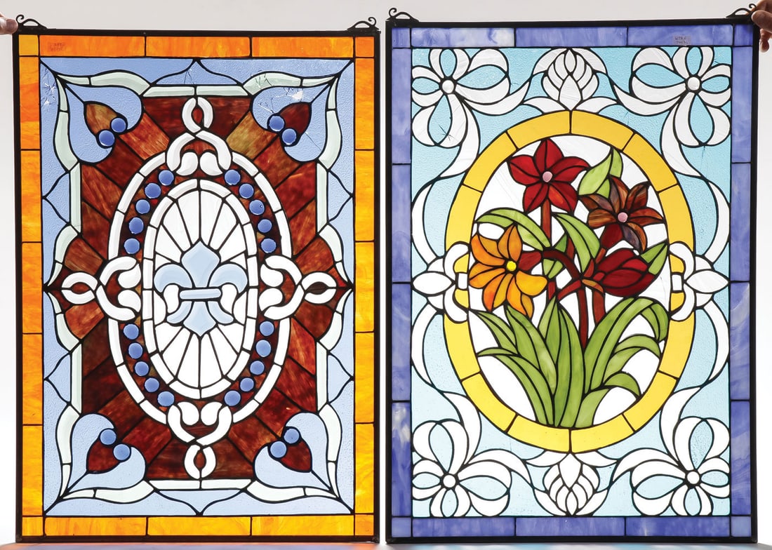 THREE LEADED GLASS WINDOW PANELS, C. 1900: THREE LEADED GLASS WINDOW PANELS, C. 1900. Comprising two with floral and cabochon jewel decoration and a clear glass leaded panel with beveled glass panels, as shown. Each in metal frames with suspen