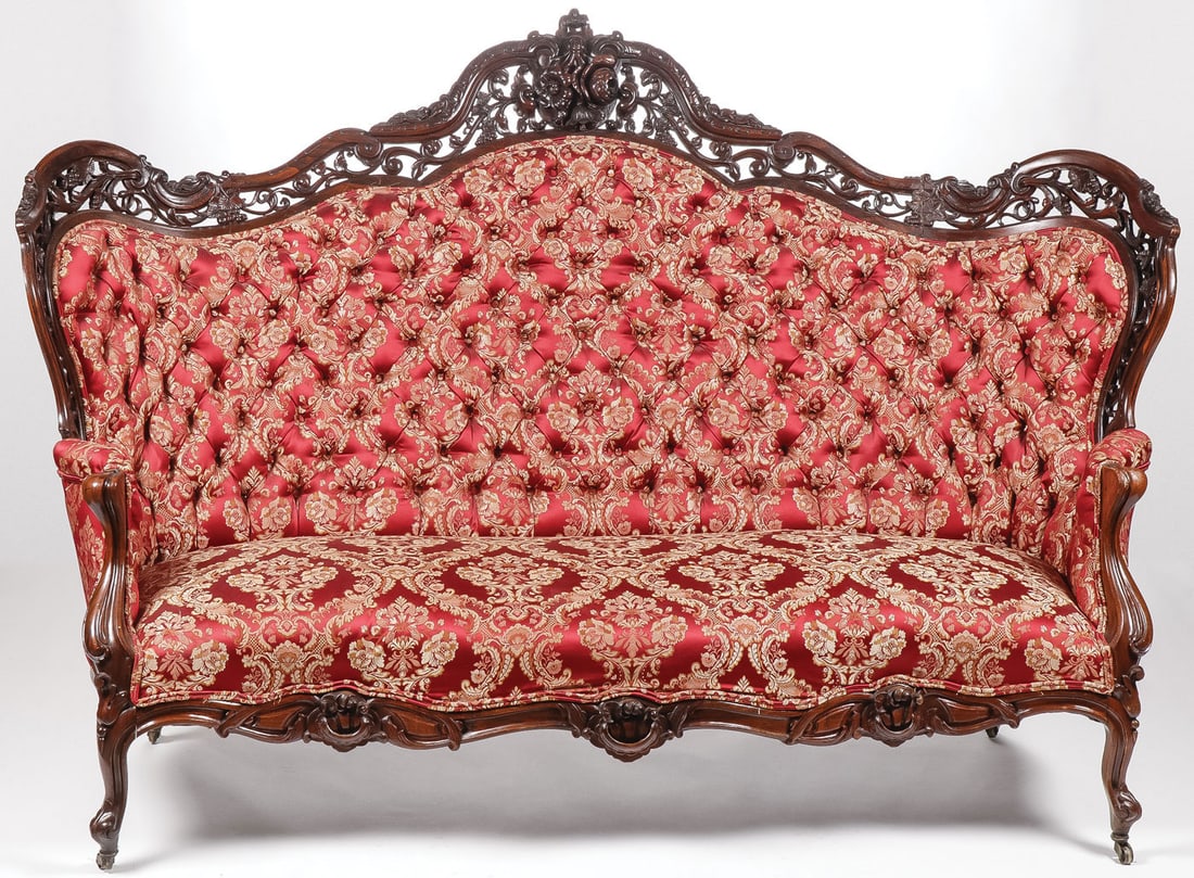 CARVED MEEKS ROSEWOOD SOFA: CARVED MEEKS ROSEWOOD ROCOCO REVIVAL. Comprising a finely carved laminated rosewood sofa with rocaille scrolled carved skirt, pierced carved back rail with floral bouquet finial and later silk coverin