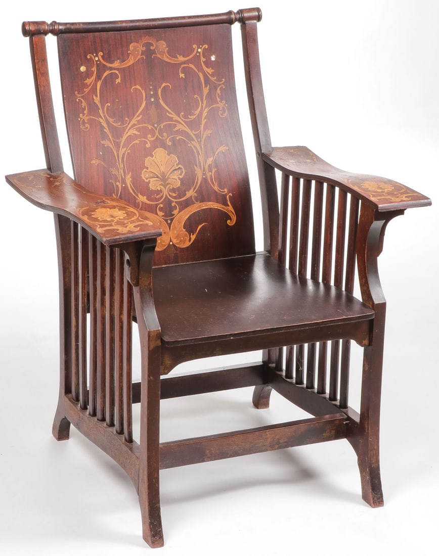 FINE INLAID AESTHETIC MOVEMENT LIBRARY CHAIR: FINE INLAID AESTHETIC MOVEMENT LIBRARY CHAIR. Comprising a solid seatback with intricate inlay depicting a floral motif flanked by similarly decorated arms above slated sides. 35.5 inches x 27.5 inche