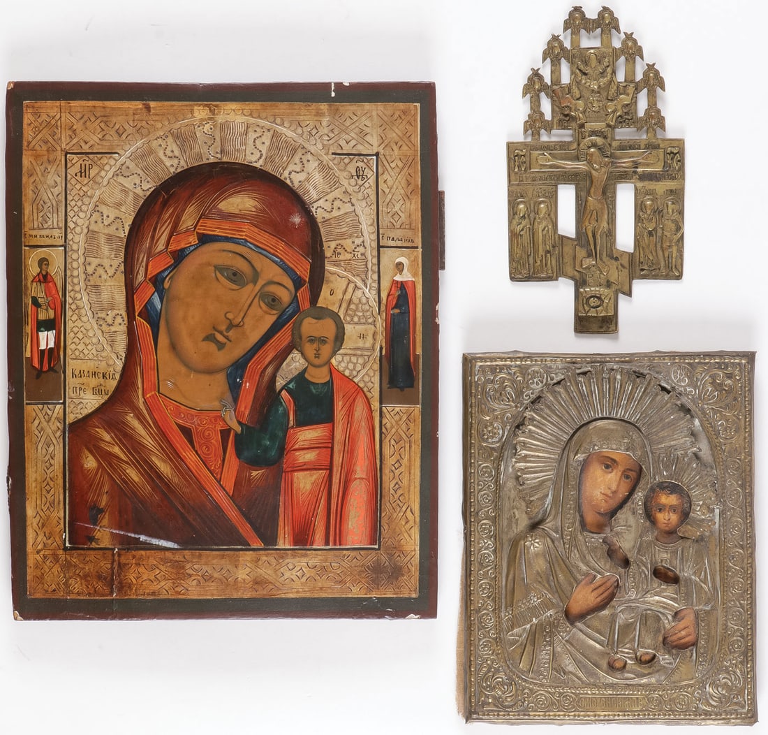 3 RUSSIAN ICONS, 19TH C: 3 RUSSIAN ICONS, 19TH C. Comprising the Kazan Mother of God, the borders with Archangel Michael and St. Pelagia. Together with a cast bronze paneled crucifix with cherubim, and an icon of the Smolensk