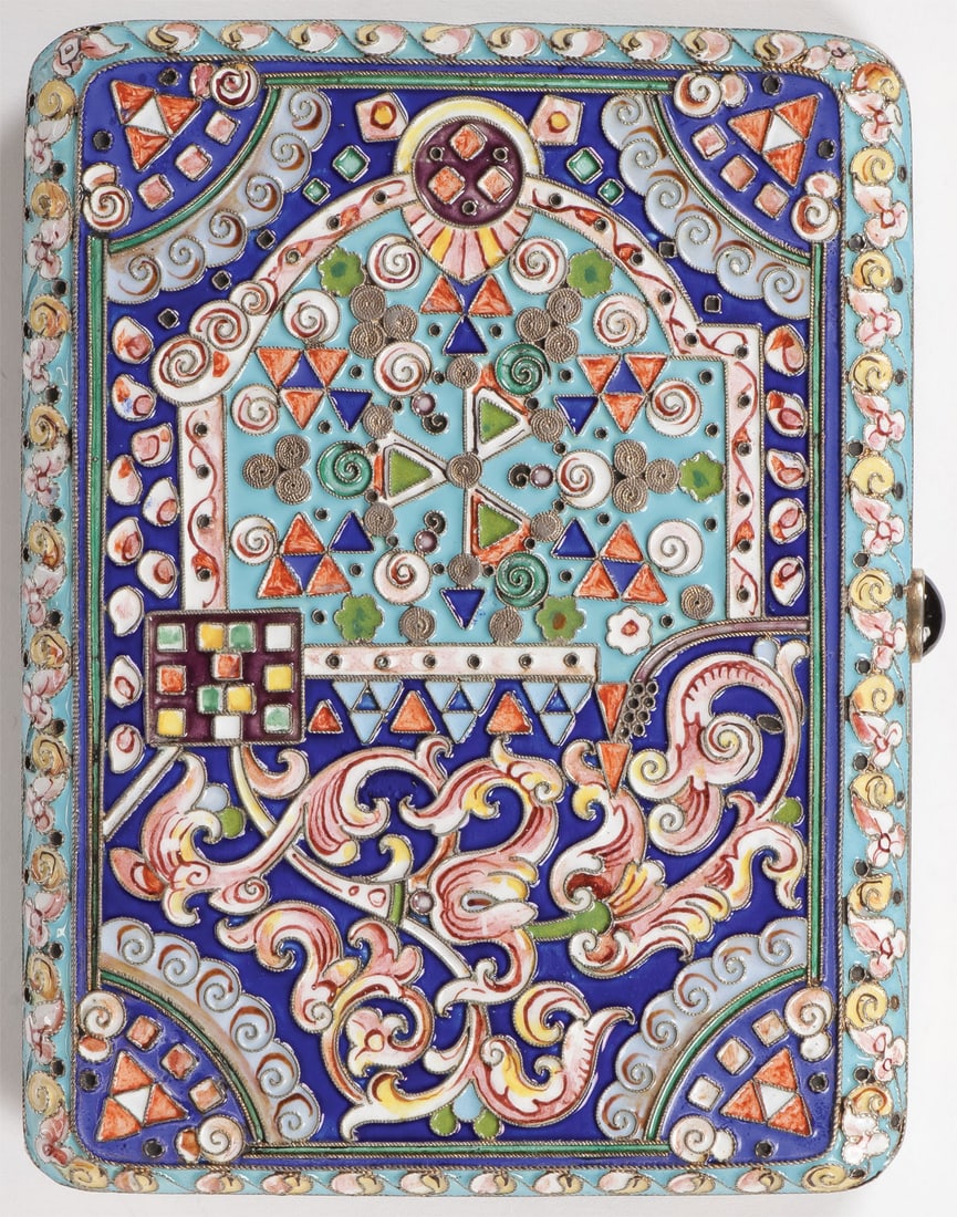 RUSSIAN SILVER & ENAMEL CIGARETTE CASE, MOSCOW: RUSSIAN SILVER & ENAMEL CIGARETTE CASE, MOSCOW C.1908. The body overall decorated in shaded enamel foliage and geometric designs in the Pan Slavic taste, with red cabochon thumb push and gilded interi