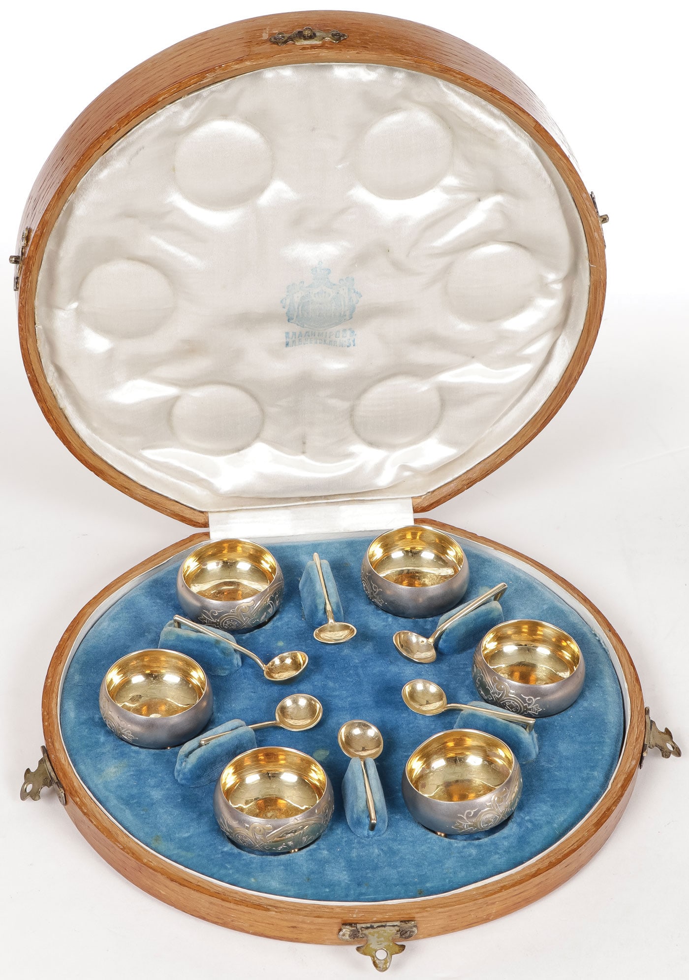 A RUSSIAN SILVER GILT CASED SALT SET, MOSCOW 1895: A RUSSIAN SILVER GILT CASED SALT SET, MOSCOW 1895. Comprising a cased set of six silver gilt engraved and footed salts with matching spoons, each hallmarked Moscow, dated 1895, Cyrillic makers mark fo