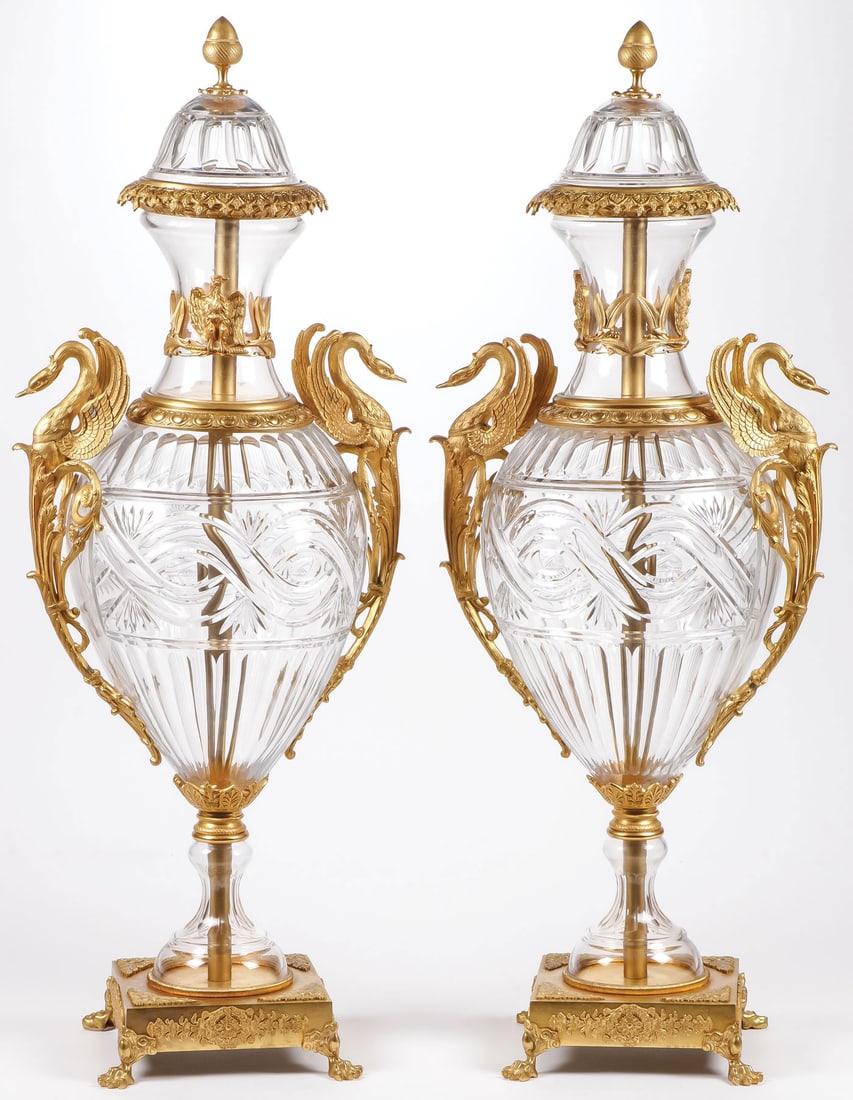 PAIR OF LARGE FRENCH GILT BRONZE & CUT-GLASS URNS: PAIR OF LARGE FRENCH GILT BRONZE & CUT-GLASS URNS. Comprising a pair of large and impressive French gilt bronze mounted cut crystal urns on ornate footed bases the cut glass urns held in a gilt bronze