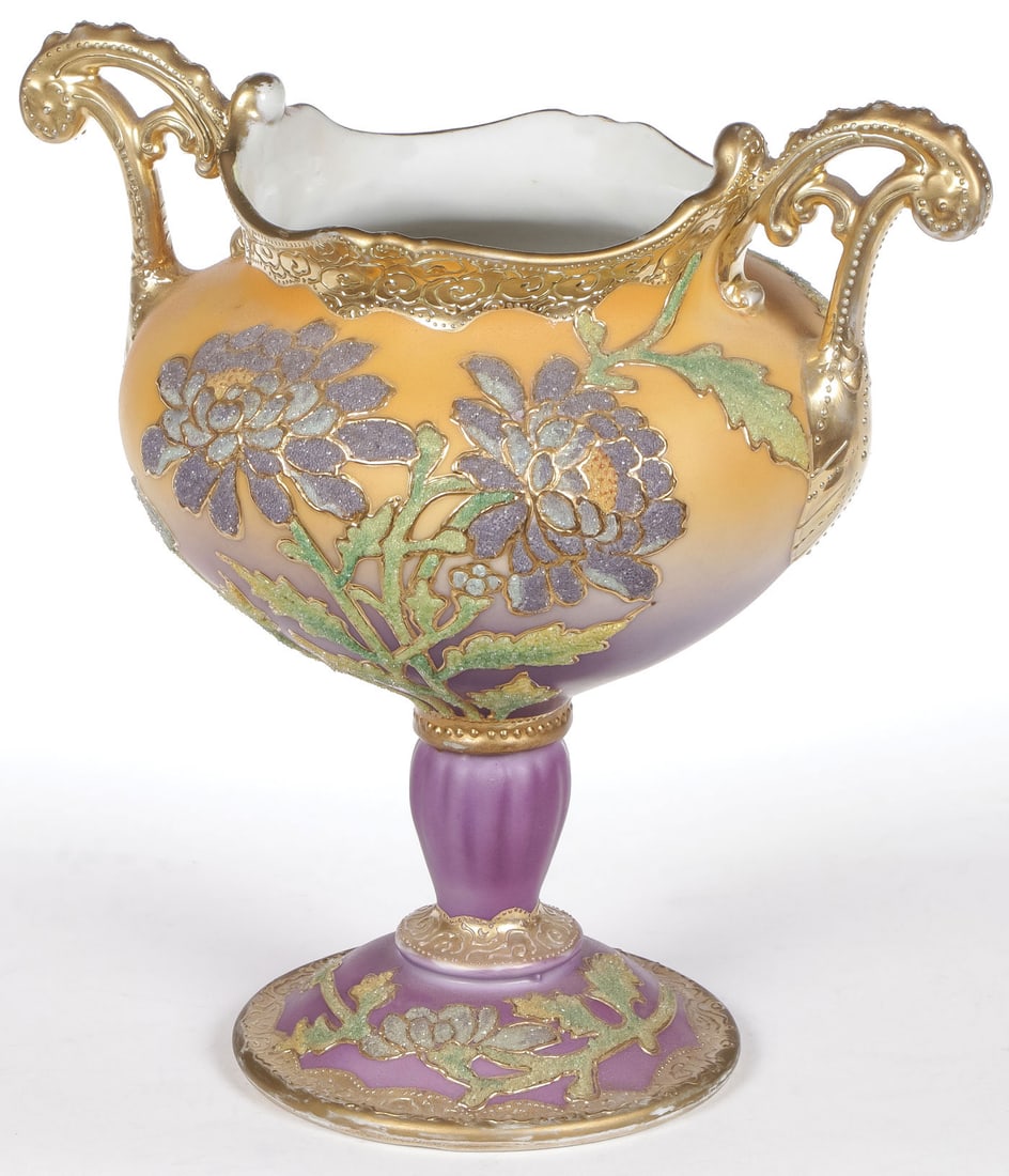 NIPPON CORALENE DECORATED FOOTED VASE, C.1909: NIPPON CORALENE DECORATED FOOTED VASE, C.1909. Comprising a large and impressive footed vase or compote with ribbed pedestal and ornate pierced handles. Overall with Coralene decorated florals and rai