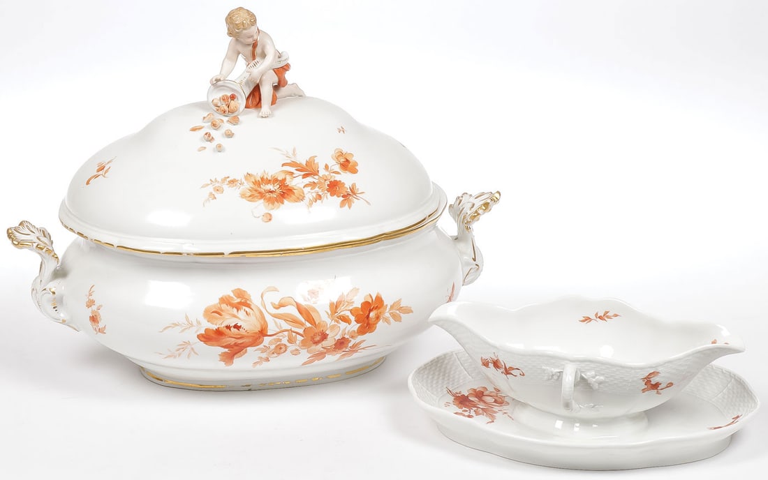 MEISSEN & KPM PORCELAIN: MEISSEN & KPM PORCELAIN. Comprising a large Meissen oval covered tureen with gilt decorated acanthus handles and scalloped rim. Decorated in monochromatic coral-red flowers, the lid with putti finial