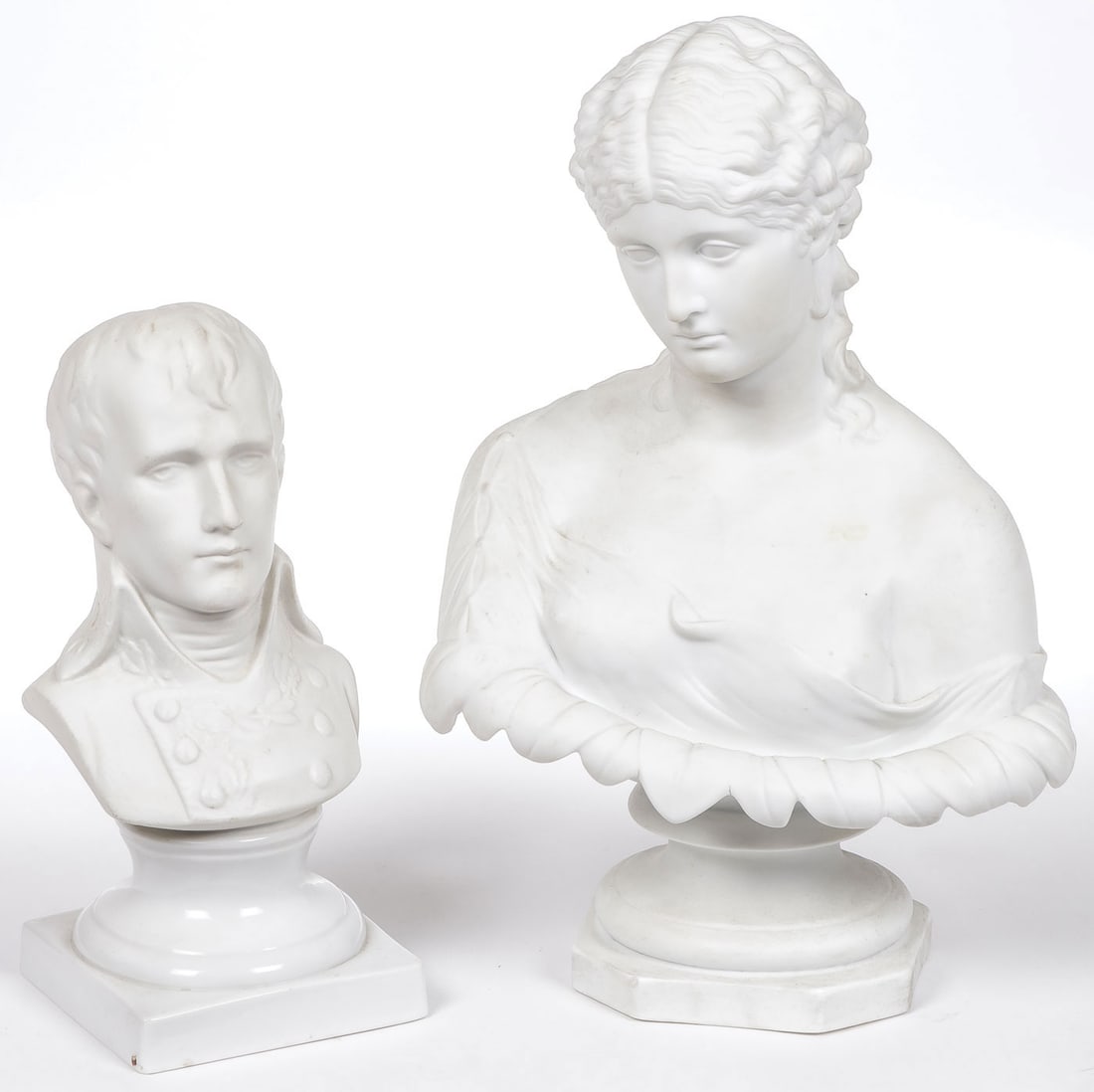 PAIR VINTAGE BISQUE PROCELAIN BUSTS: PAIR VINTAGE BISQUE PROCELAIN BUSTS. Comprising a bust of the young Napolean, height 8.5 inches, and an English bust of Clytie on integral socle base, height 11.75 inches.SHIPPING NOTICE:Except for