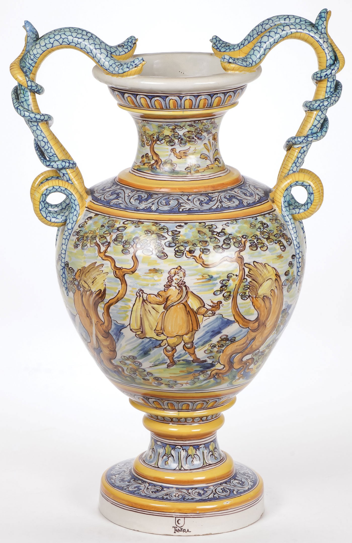 LARGE ITALIAN MAJOLICA URN: LARGE ITALIAN MAJOLICA URN. With serpent form handles and decorated with a man in a wooded landscape with bird. Marked on front of rim, Height 25.25 inches (64cm). SHIPPING NOTICE: Except for large, o