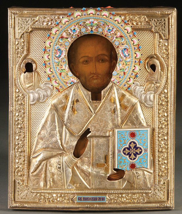 RUSSIAN ICON, ST. NICHOLAS, SILVER & ENAMEL 1908-1917: A RUSSIAN ICON OF SAINT NICHOLAS, MOSCOW, 1908-1917. Overlaid with a very fine silver-gilt repousse and engraved riza with ornate shaded enamel halo and champlevé enamel Gospel cover and title plaqu