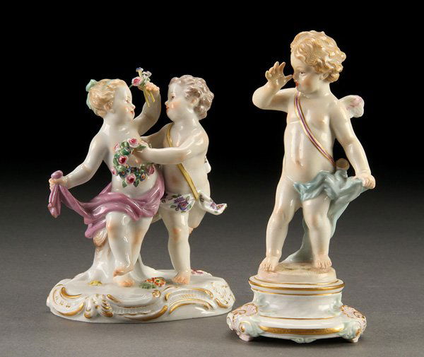 A PAIR OF MEISSEN GERMAN PORCELAIN FIGURES: A PAIR OF MEISSEN GERMAN PORCELAIN FIGURES, EARLY 20TH CENTURY. In the form of a cupid thumbing his nose and two dancing putti. Each with blue crossed sword marks under glaze. Height 5.5 inches (14 c