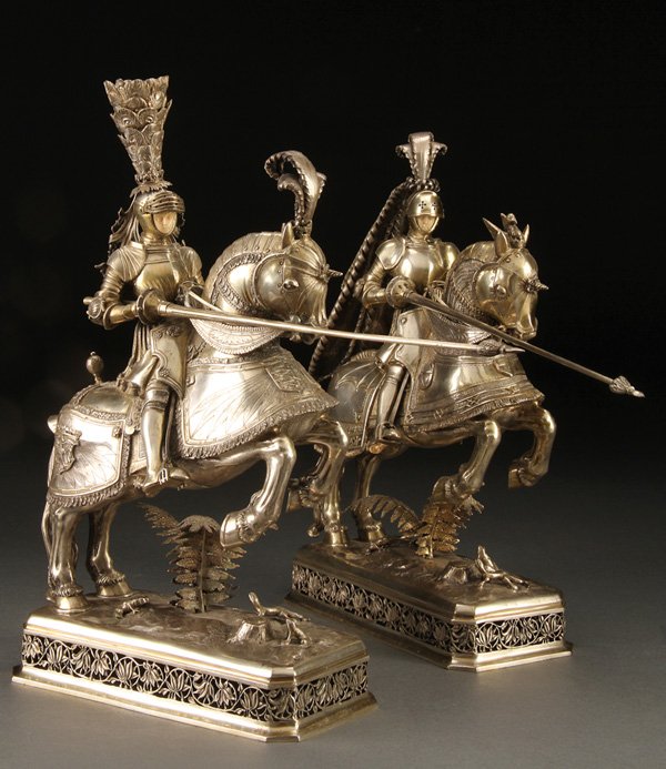 A PAIR OF SILVER AND IVORY JOUSTING KNIGHTS: AN IMPESSIVE PAIR OF SILVER AND IVORY JOUSTING KNIGHTS, PROBABLY GERMAN, 19TH CENTURY. Each finely modeled, cast and repoussed with detailed tool work in the form of two opposing knights in full armor