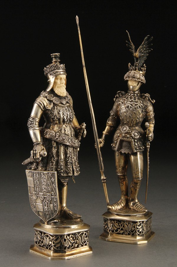A PAIR OF CARVED IVORY & SILVER GERMANIC KNIGHTS: A VERY FINE PAIR OF CARVED IVORY AND SILVER-GILT GERMANIC KNIGHTS, PROBABLY AUSTRIAN, LATE 19TH CENTURY. Each finely modeled with ornate repoussed armor in the form of Germanic knights, one with a win