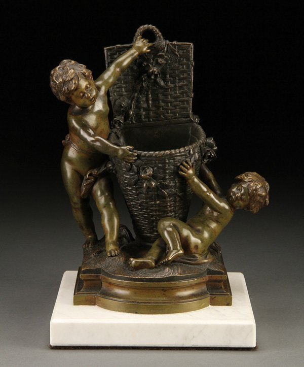 AUGUSTE MOREAU BRONZE FIGURAL MATCH HOLDER: AUGUSTE MOREAU BRONZE FIGURAL MATCH HOLDER. Auguste Moreau (French 1834-1917), a bronze figural match holder modeled as two young putti with an open lidded basket raised on marble stand. Inscribed “