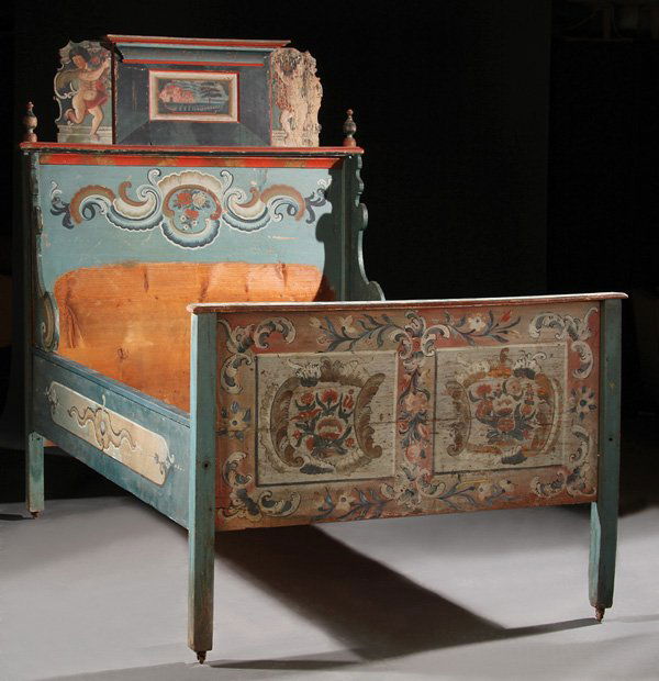 AUSTRIAN PAINTED TYROLEAN BEDSTEAD: A GOOD AUSTRIAN PAINTED BEDSTEAD, TYROLEAN, EARLY 19TH CENTURY. Painted with floral reserves and scrolls on a two-tone pale blue and cream ground, the headboard surmounted with figural painted putti.