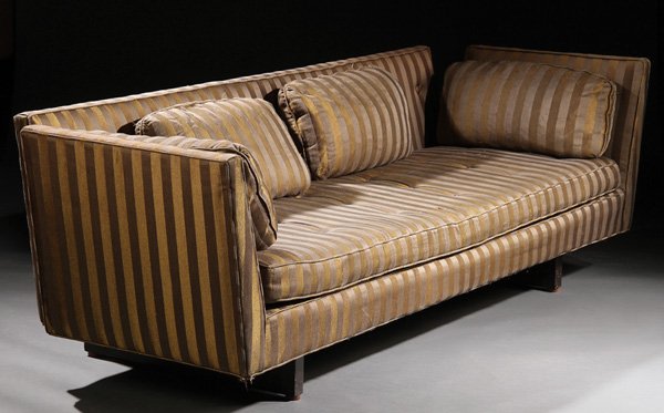 SOFA, EDWARD WORMLEY FOR DUNBAR: EDWARD WORMLEY FOR DUNBAR, SOFA, MID 20TH CENTURY. With tufted cushions. Upholstered in striped brown and gold and on mahogany legs.