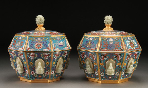 CHINESE CLOISONNÉ GILT BRONZE & JADE BOXES: A PAIR OF CHINESE CLOISONNÉ GILT BRONZE AND CARVED JADE COVERED BOXES. Each of tapering octagonal form with conforming domed lids. Enameled with auspicious Buddhist motifs and surmounted with jade fi