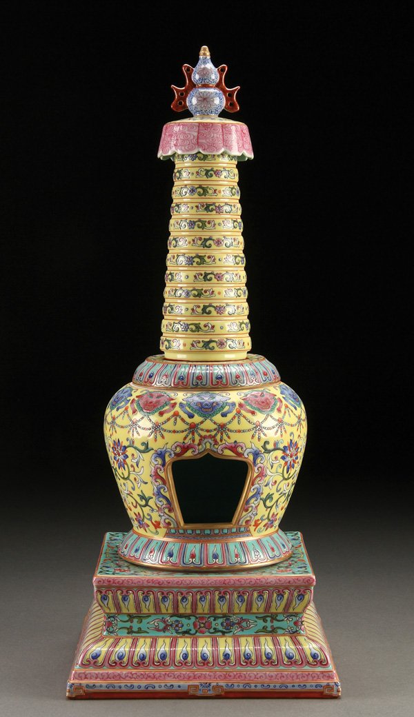 CHINESE FAMILLE ROSE PORCELAIN STUPA: A CHINESE FAMILLE ROSE AND IMPERIAL YELLOW GLAZED PORCELAIN STUPA. Comprising four sections. Each finely enameled with Buddhist symbols. The base with Qianlong style seal form reign mark in red on tur