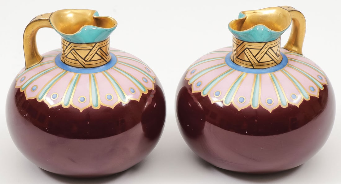 IMPERIAL PORCELAIN WINE JUGS: IMPERIAL PORCELAIN WINE JUGS. Comprising a matching pair of wine jugs, Imperial Porcelain Factory, St. Petersburg. Decorated in the Gothic taste on a magenta ground with pinched spout and gilt handle,