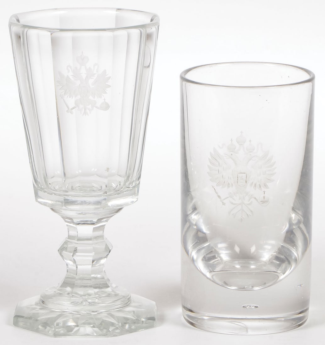 RUSSIAN IMPERIAL GLASSWORKS, GOBLET & TUMBLER: RUSSIAN IMPERIAL GLASSWORKS, GOBLET & TUMBLER. The footed goblet with cut panels and etched with the Imperial double headed eagle, height 5.75 in (14.5 cm). Together with a heavily weighted tumbler, l