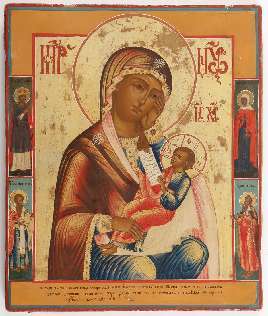 A FINE RUSSIAN ICON OF THE MOTHER OF GOD, C. 1800: A FINE RUSSIAN ICON OF THE MOTHER OF GOD, C. 1800. Comprising a finely painted image of the Soothe the Ills Mother of God. The infant Christ reclines in his mother's lap holding a scroll with words ta