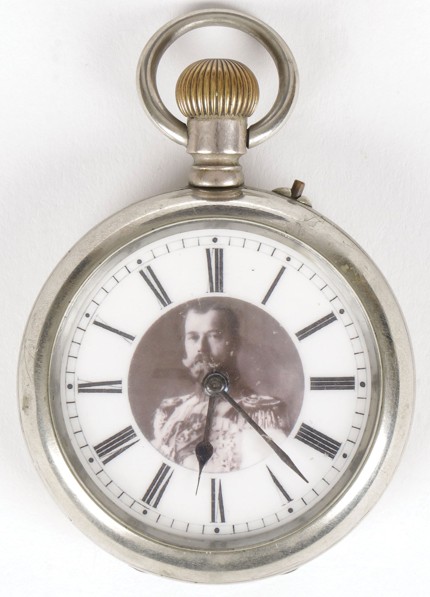 A SWISS WATCH FOR THE RUSSIAN MARKET: A SWISS WATCH FOR THE RUSSIAN MARKET. Comprising an open face Billodes watch, the enameled dial with a bust portrait of Nicholas II, and Arabic numerals, takes a wind and runs, diameter excluding wind