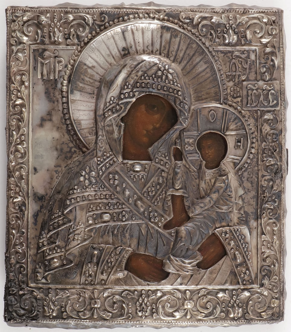 RUSSIAN ICON OF THE MOTHER OF GOD, 18TH?C: RUSSIAN ICON OF THE MOTHER OF GOD, 18TH?C. Comprising an icon of the Schui-Smolenskaya Mother of God. Overlaid with a silver repousse and chased oklad. Stamped with 84 silver standard and Cyrillic mak