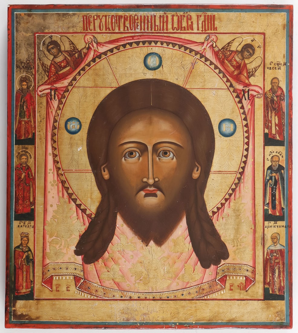 RUSSIAN ICON OF THE HOLY NAPKIN, NEVYANSK, 19TH C: RUSSIAN ICON OF THE HOLY NAPKIN, NEVYANSK, 19TH C. Here is depicted the Holy napkin upon which Christ's face was miraculously transferred, held aloft by two angels, the borders painted with six family