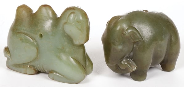 A PAIR OF CHINESE CARVED JADE ANIMAL PENDANTS