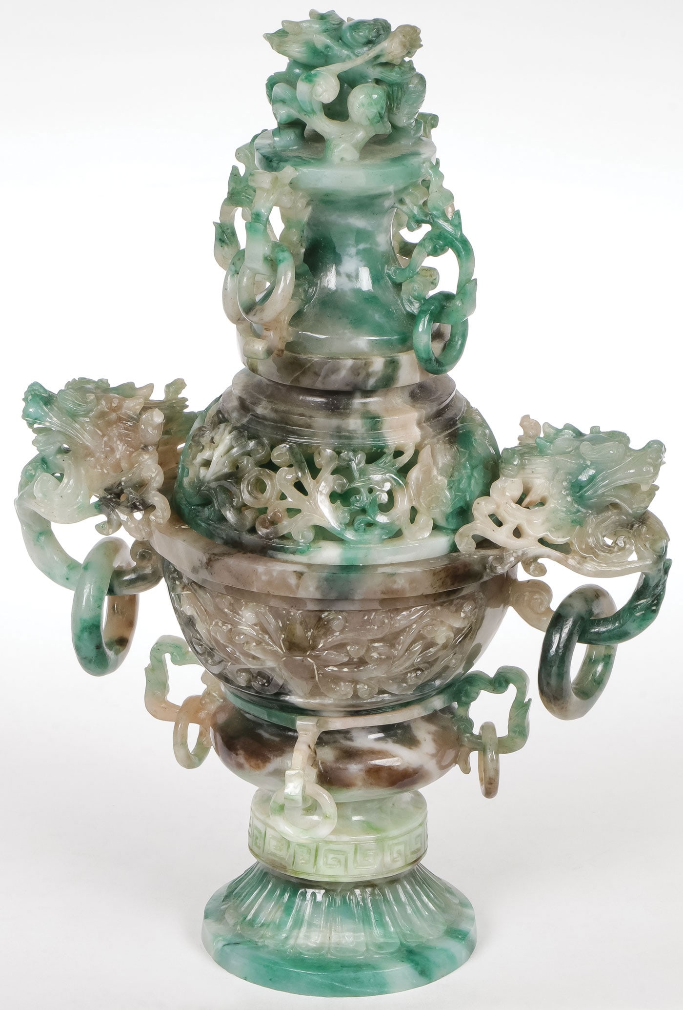 ORNATE CHINESE CARVED JADEITE CENSER: ORNATE CHINESE CARVED JADEITE CENSER. Comprising an impressive and intricately carved mottled jadite censer, probably early Republic period. The flared base beneath rings handles, and above the bowl b