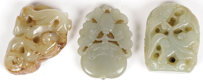 THREE CHINESE CARVED JADE PENDANTS, QING