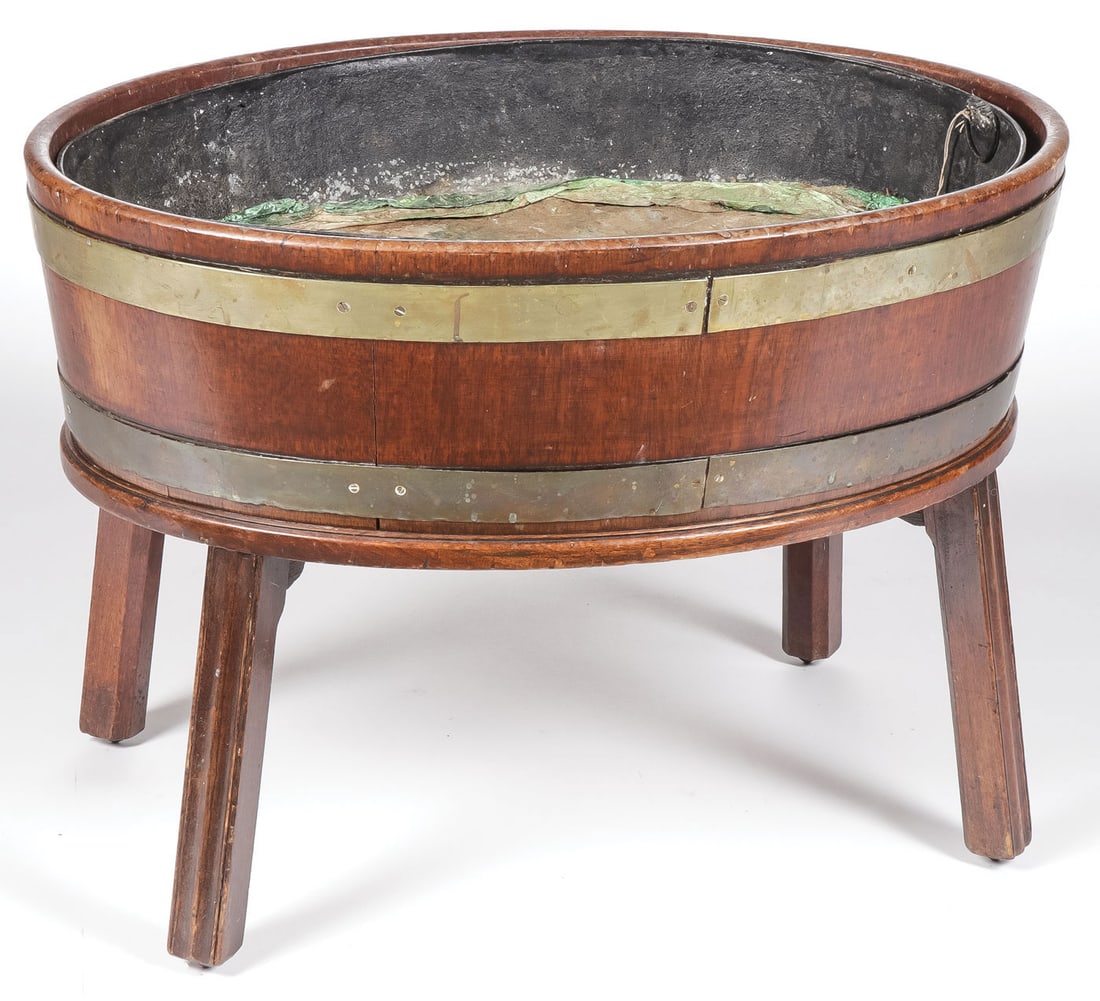 A GEORGE III MAHOGANY WINE COOLER: A GEORGE III MAHOGANY WINE COOLER. Comprising a traditional George III mahogany wine cooler/cellarette, with brass bands on chamfered legs and with original lead liner Height 20 inches, width 20.5 inc