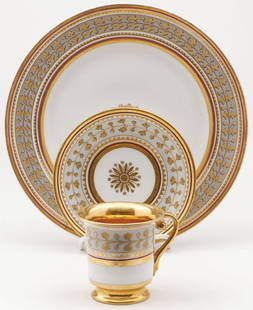 RUSSIAN IMPERIAL PORCELAIN PLACE SETTING: RUSSIAN IMPERIAL PORCELAIN PLACE SETTING. Comprising a 3-piece place setting from the Babygon Service, Imperial Porcelain Factory, period of Nicholas II. The borders decorated with wide gilt foliate b
