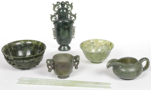 6 PIECES CHINESE CARVED JADE: 6 PIECES CHINESE CARVED JADE. Comprising a carved spinach jade lidded vessel, a carved double handled cup, a translucent carved bowl, a carved teapot, pair of carved chopsticks and a carved green hard