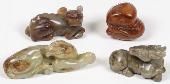 FOUR CHINESE CARVED JADE FIGURES