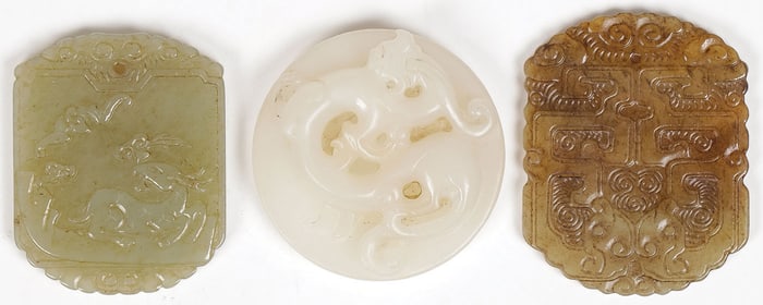 THREE CHINESE CARVED JADE PENDANTS, QING