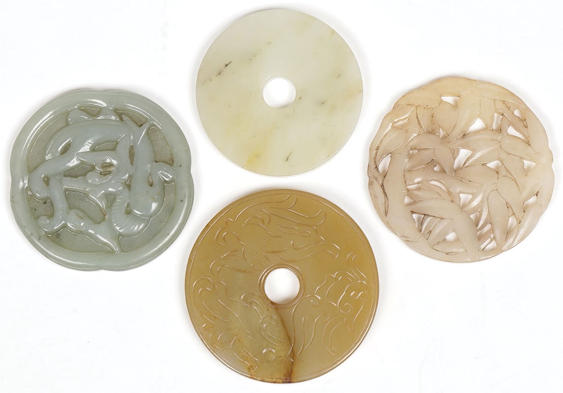 FOUR CHINESE CARVED JADE ROUND PENDANTS (1 of 2)