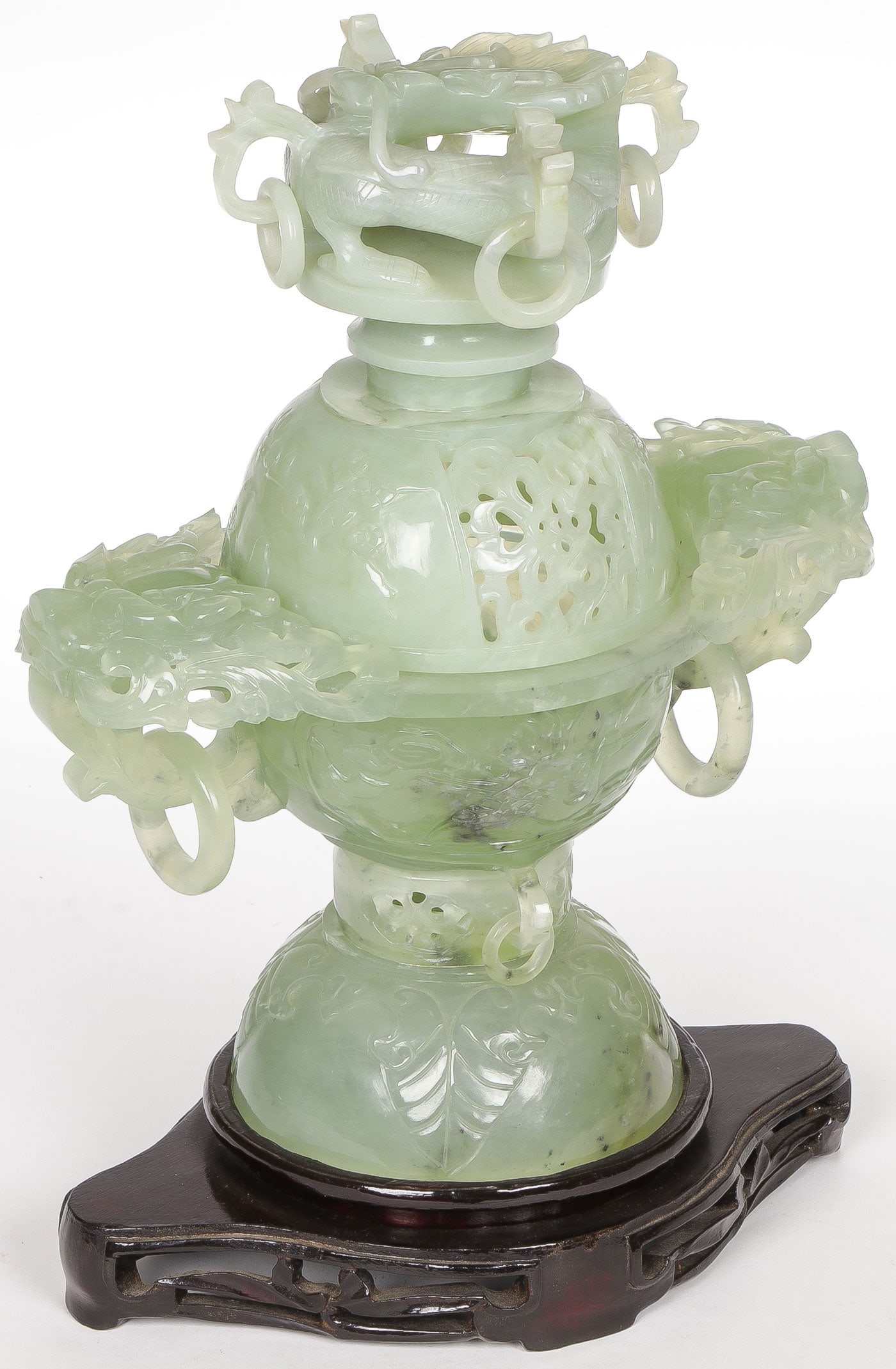 CHINESE CARVED HARDSTONE CENSER: CHINESE CARVED HARDSTONE CENSER. Finely carved in three pieces with ringed dragon head handles on main section and pierced covered finial, resting on a conforming carved wood stand. Height of censer 1