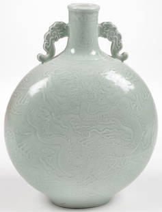 CHINESE CELADON MOON FLASK VASE: CHINESE CELADON MOON FLASK VASE. Comprising a large and impressive vase overall decorated with dragons amidst clouds and the neck decorated with bats, underside with blue archaic mark. Height 16.75 in