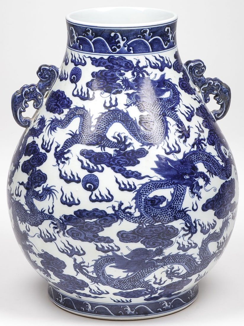 LRG CHINESE BLUE & WHITE HU VASE: LRG CHINESE BLUE & WHITE HU VASE. Comprising a large and impressive blue and white decorated Hu from vase, overall decorated with dragons and clouds and underside with blue underglaze archaic mark. He