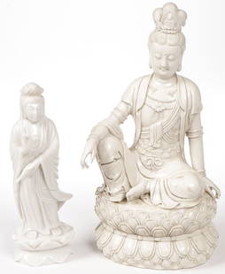 CHINESE GUANYIN & BUDDHA.: CHINESE GUANYIN & BUDDHA.. Comprising a carved white hardstone figure of a standing of Guanyin together with a Blanc de chine porcelain figure of a Buddha on a double lotus base and with impressed mar
