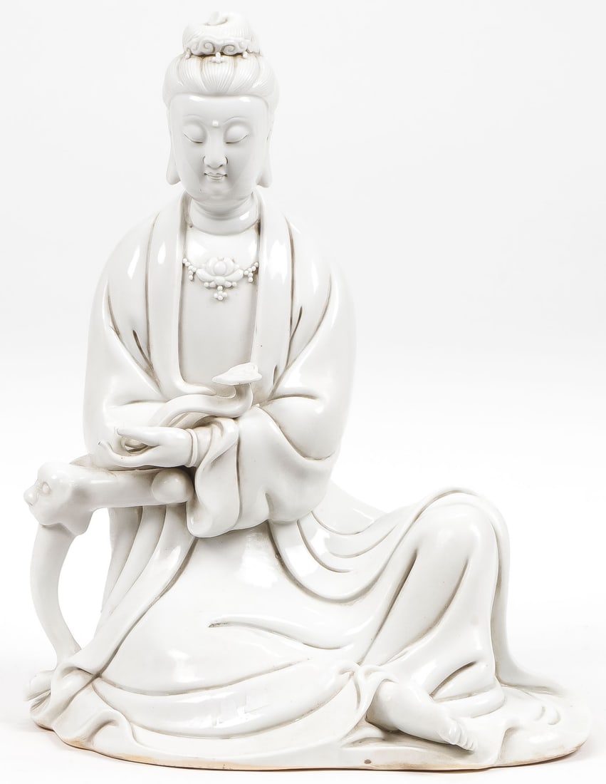 CHINESE DEHUA PORCELAIN BUDDHA: CHINESE DEHUA PORCELAIN BUDDHA. Finely modeled in full round holding a ruyi scepter. Height 11.25 inches (28.5cm). NO RESERVE. SHIPPING NOTICE: Except for large, oversized items, Jackson's is your sol