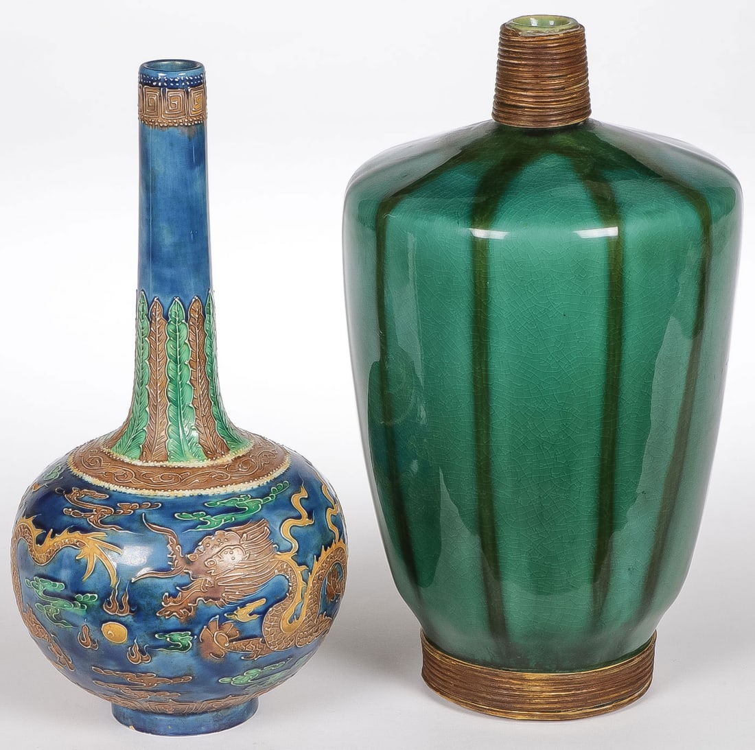 CHINESE VASES: CHINESE VASES. Comprising a bottle form slip decorated dragon vase, underside with convincing six-character blue underglaze mark. Together with a green crackled glazed wine bottle. Height 11.75 inches