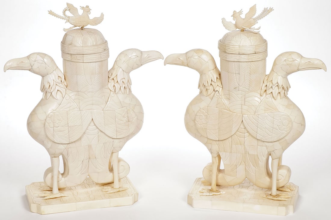PAIR OF CHINESE CARVED BONE MANTEL VASES: PAIR OF CHINESE CARVED BONE MANTEL VASES. Comprising a pair of Chinese carved laminated bone vases, each depicting opposing exotic birds around a cylindrical form vase and with domed fitted cap set wi