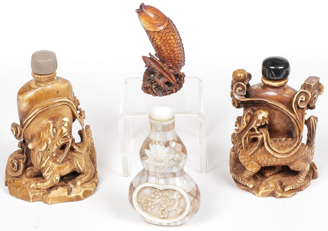 FOUR CHINESE SNUFF BOTTLES: FOUR CHINESE SNUFF BOTTLES. Comprising two large carved mammoth bottles, each with dragons, one with custom fitted box. Together with a gourd form decorated in MOP lamination, also in custom fitted bo
