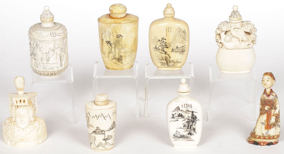 EIGHT CHINESE CARVED SNUFF BOTTLES: EIGHT CHINESE CARVED SNUFF BOTTLES. Of various shapes and sizes as shown including two figural examples and of various materials including both and bone, circa 1900-1920. Greatest height, 3.1 inches (