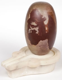 AN INDIAN SHIVA LINGAM AND HOLDER